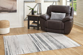 3 Brothers Decor - Ashley Furniture - Abanett Rug - 7'10" x 10'2" Rug - R403781