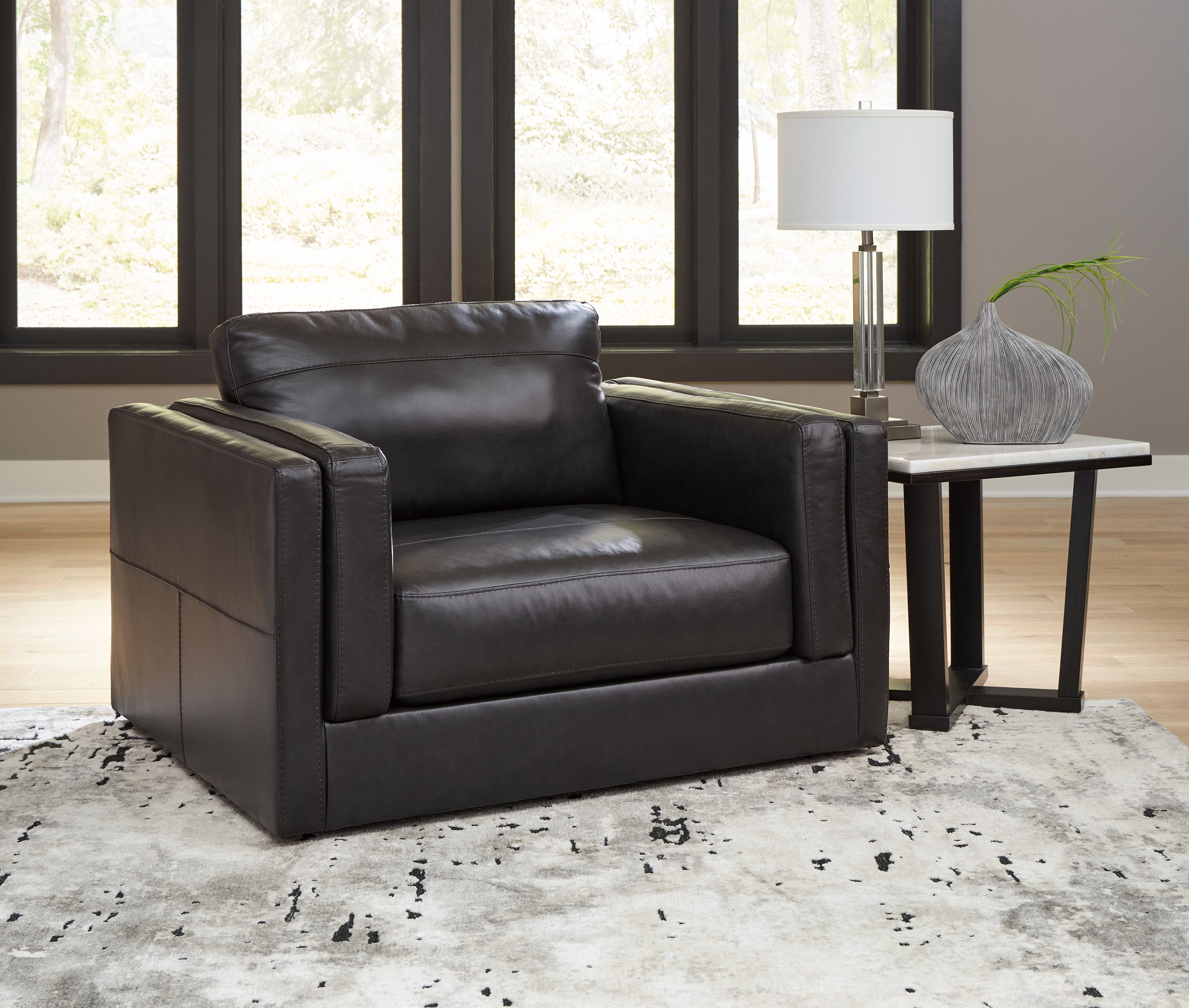 3 Brothers Decor - Ashley Furniture - Amiata Living Room - Chair and a Half / Onyx - 5740523