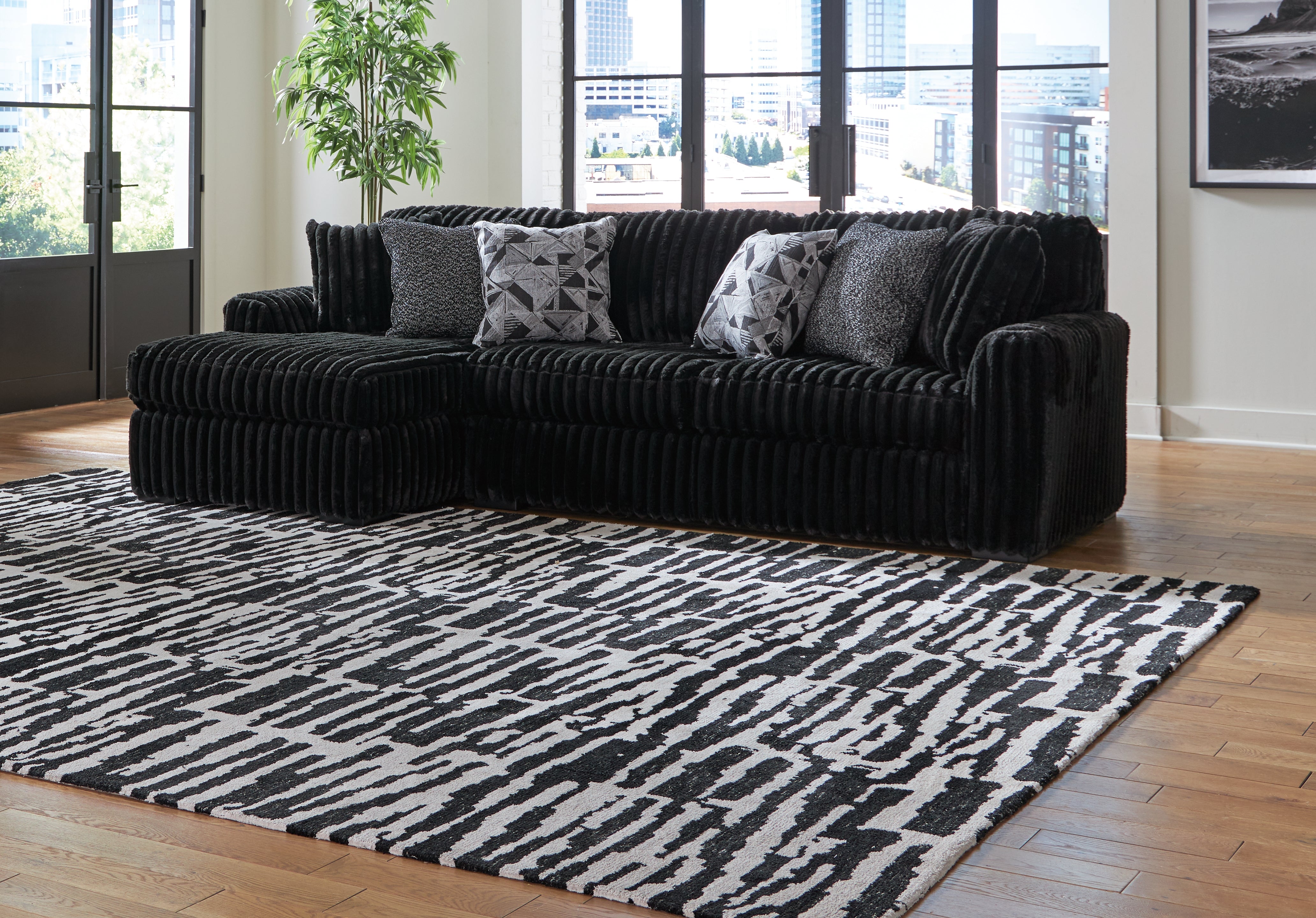 3 Brothers Decor - Ashley Furniture - Midnight-Madness Sectional - RAF 2-Piece Sectional Sofa with Chaise / Onyx - 98103S1