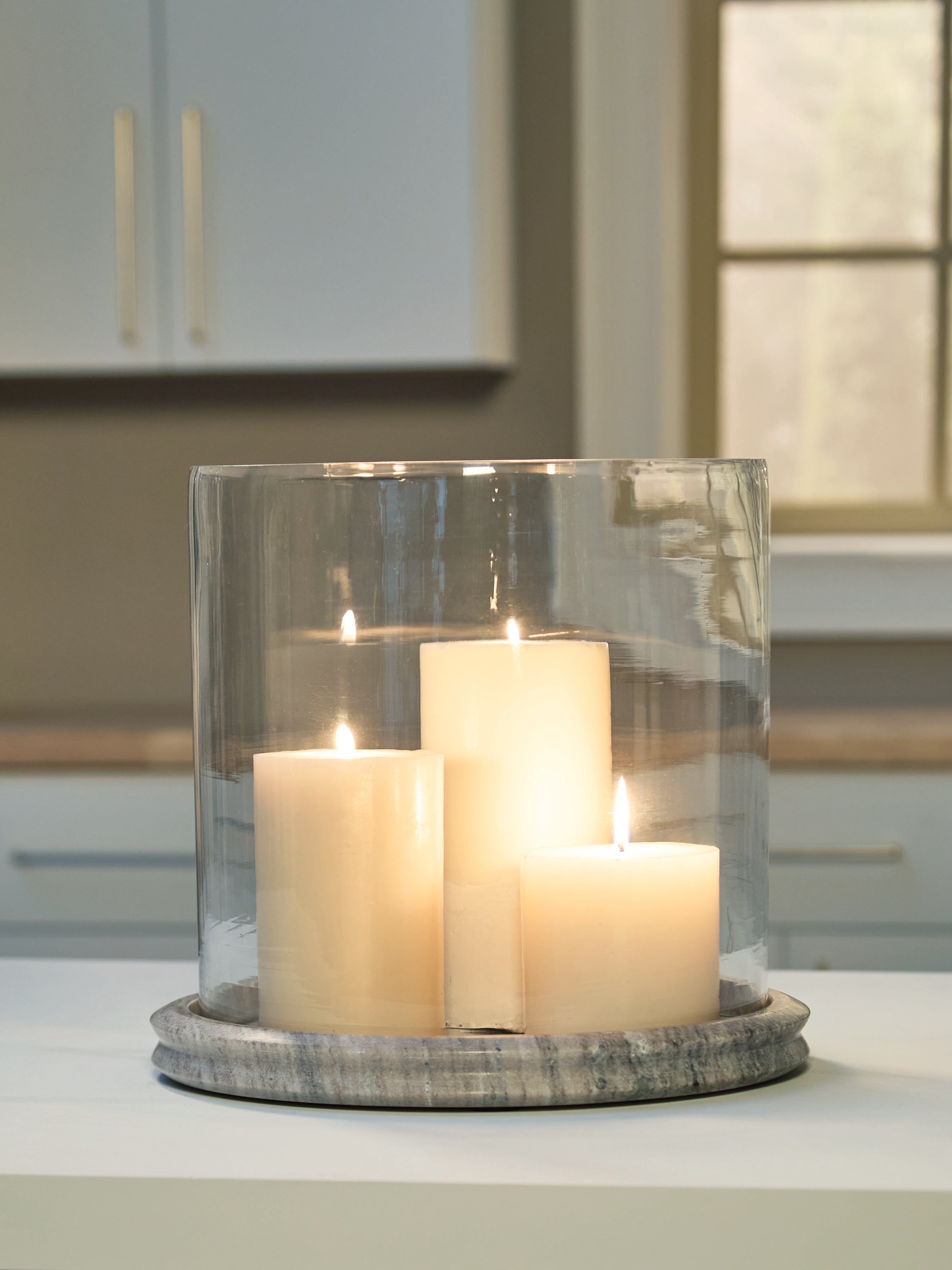 3 Brothers Decor - Ashley Furniture - Saskia Candle Holder - Candle Holder / Clear/Beige - A2000847