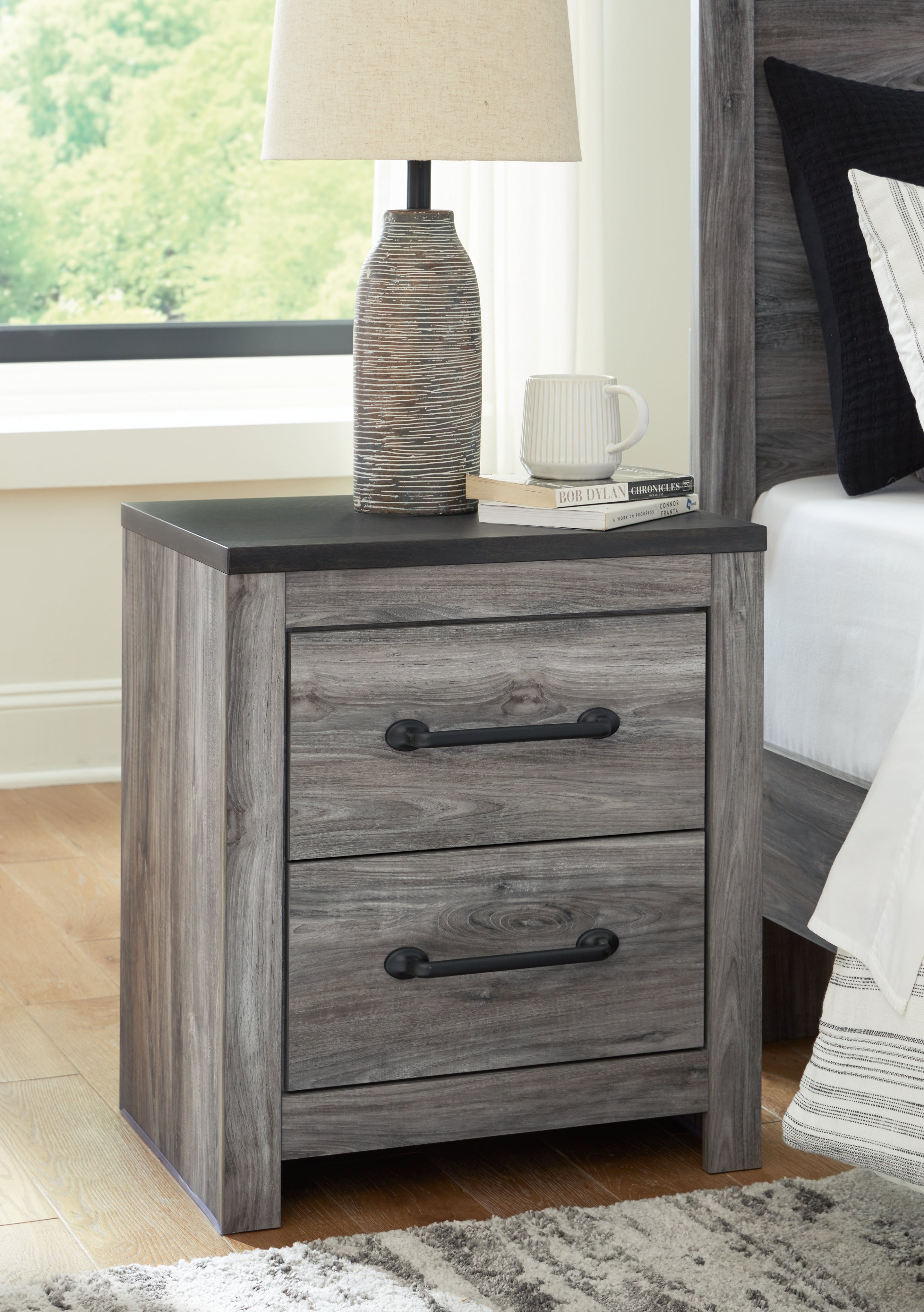 3 Brothers Decor - Ashley Furniture - Bronyan Bedroom - Two Drawer Night Stand / Dark Gray - B1290-92