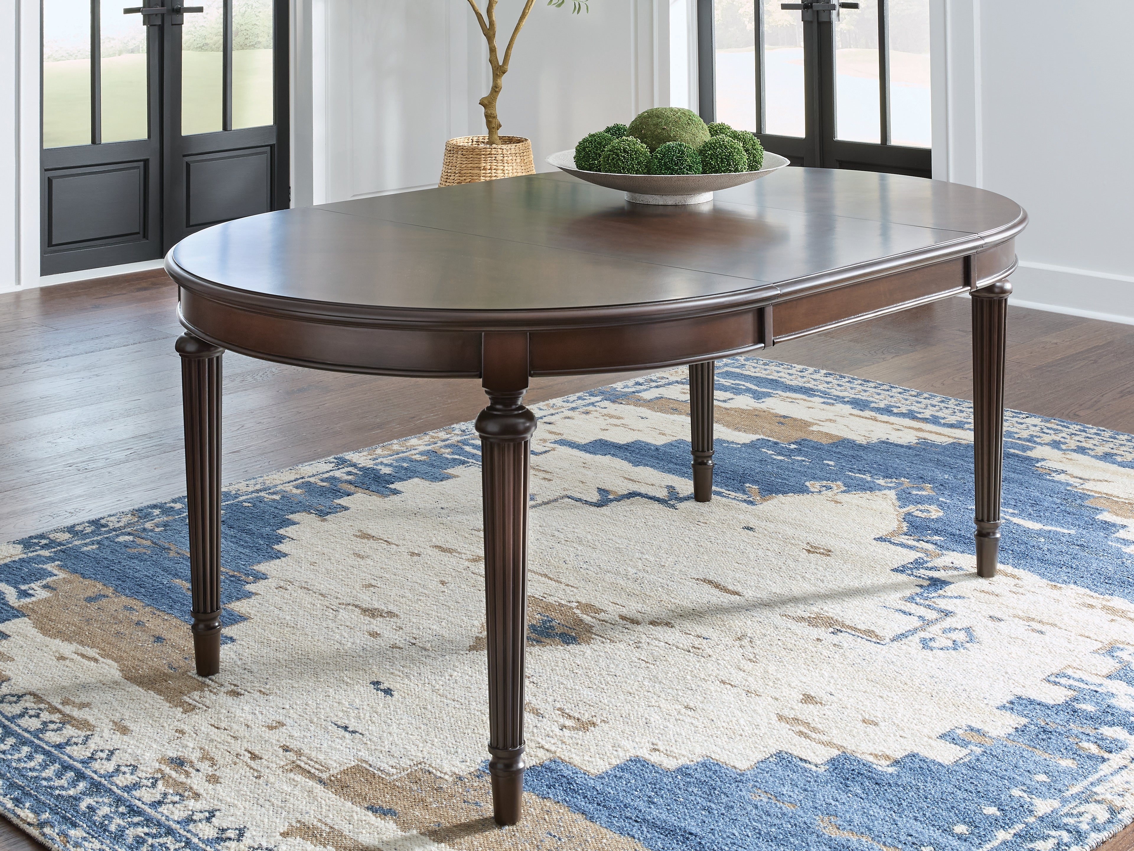 3 Brothers Decor - Ashley Furniture - Lavinton Dining Room - Oval Dining Room EXT Table / Brown - D764-35