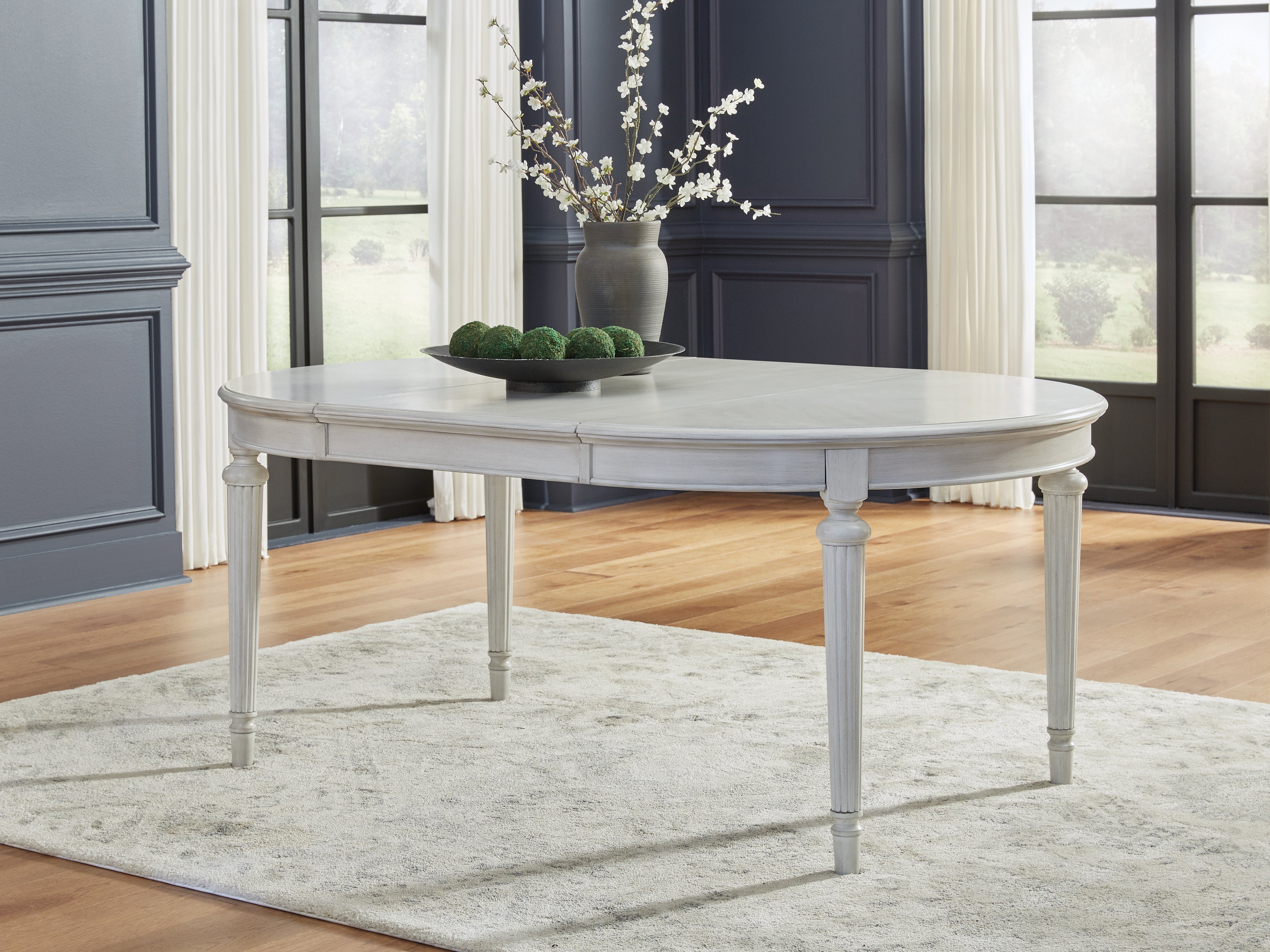 3 Brothers Decor - Ashley Furniture - Montelaine Dining Room - Oval Dining Room EXT Table / Antique White - D795-35