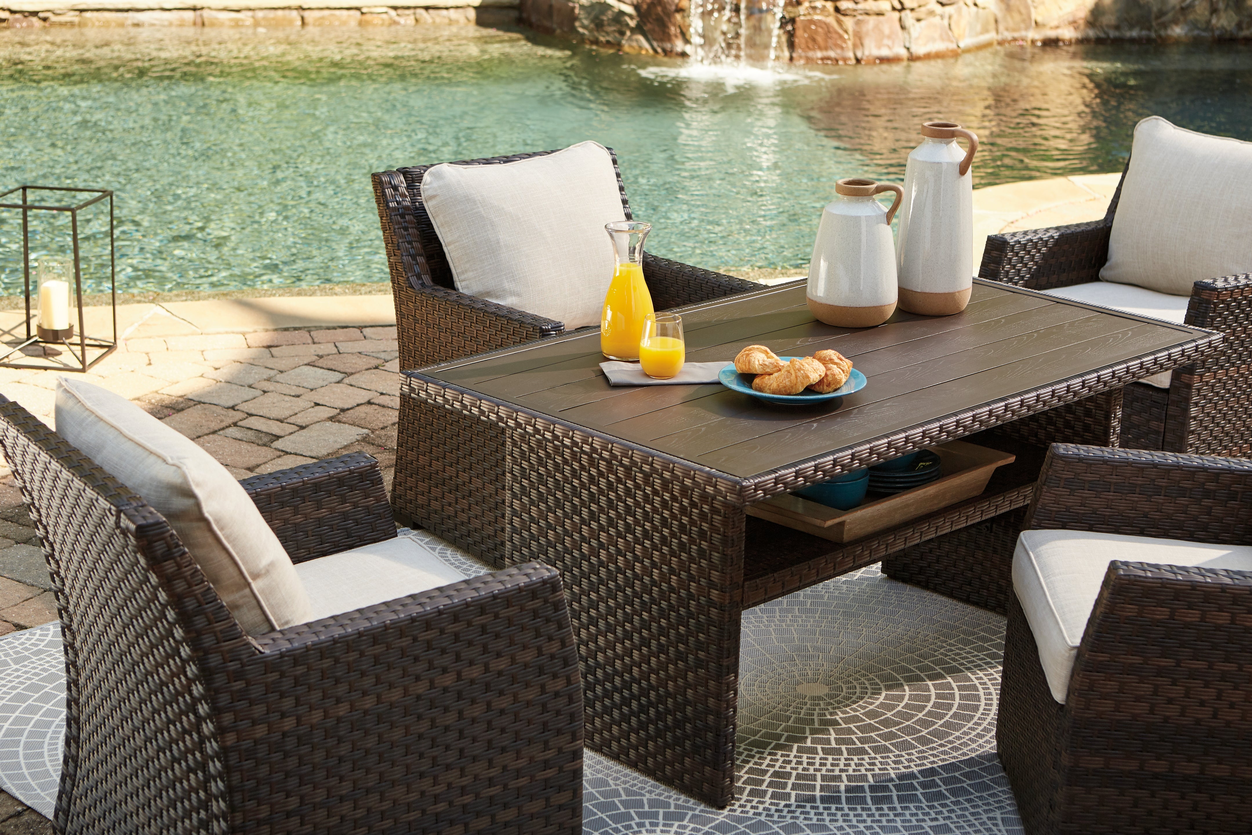 3 Brothers Decor - Ashley Furniture - Easy Isle Outdoor - RECT Multi-Use Table / Dark Brown/Beige - P455-625
