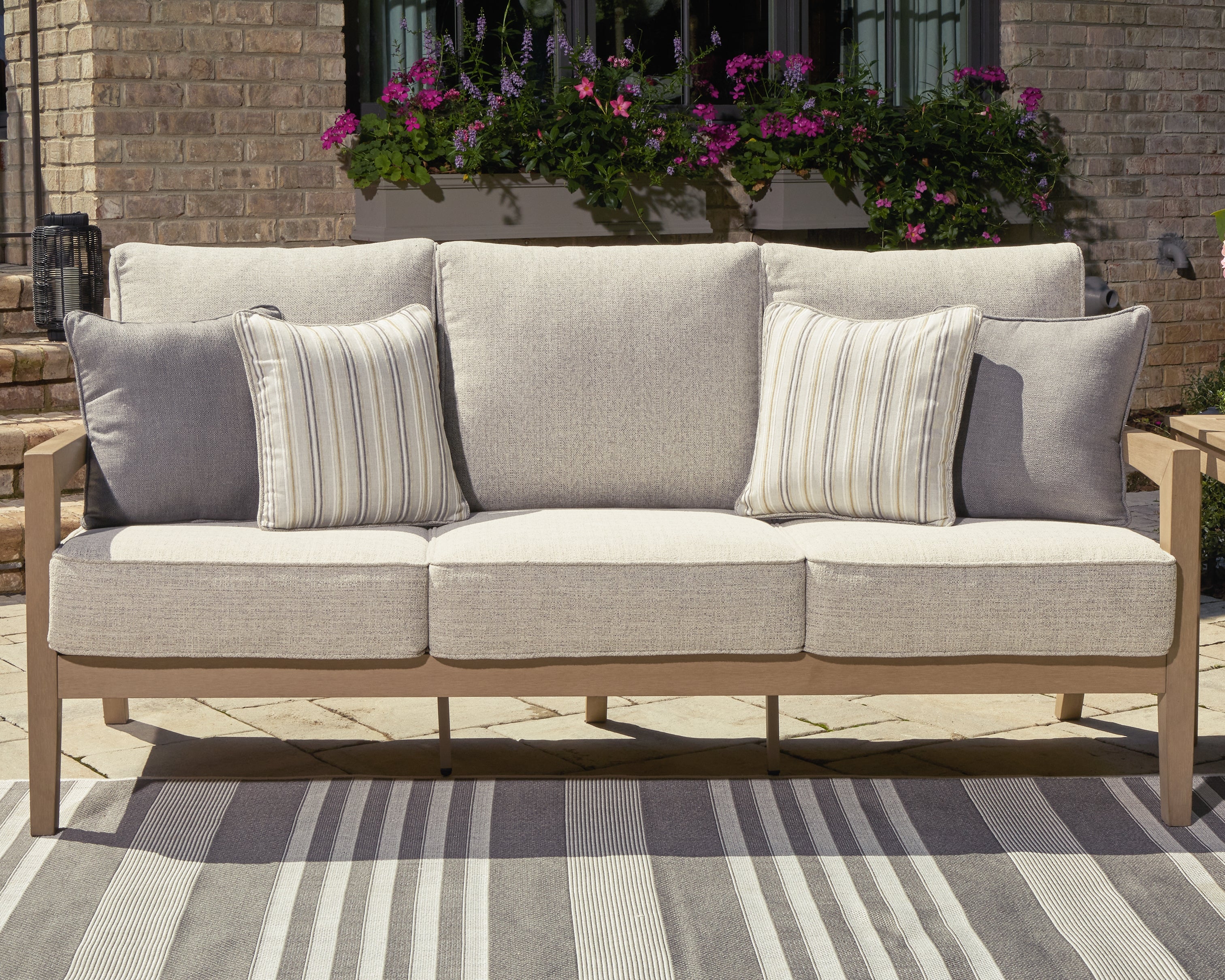 3 Brothers Decor - Ashley Furniture - Hallow Creek Outdoor - Sofa with Cushion / Driftwood - P560-838