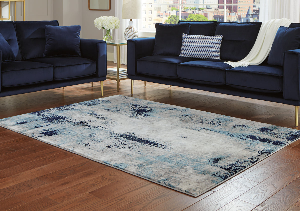 3 Brothers Decor - Ashley Furniture - Leonelle Rug - 7'10" x 10' Rug / White/Blue/Gray - R404871