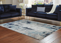 3 Brothers Decor - Ashley Furniture - Leonelle Rug - 7'10" x 10' Rug / White/Blue/Gray - R404871