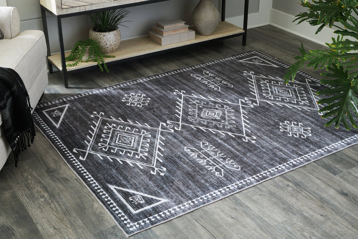 3 Brothers Decor - Ashley Furniture - Arloman Rug - 5' x 7' Washable Rug / Black/Cream/Gray - R405932