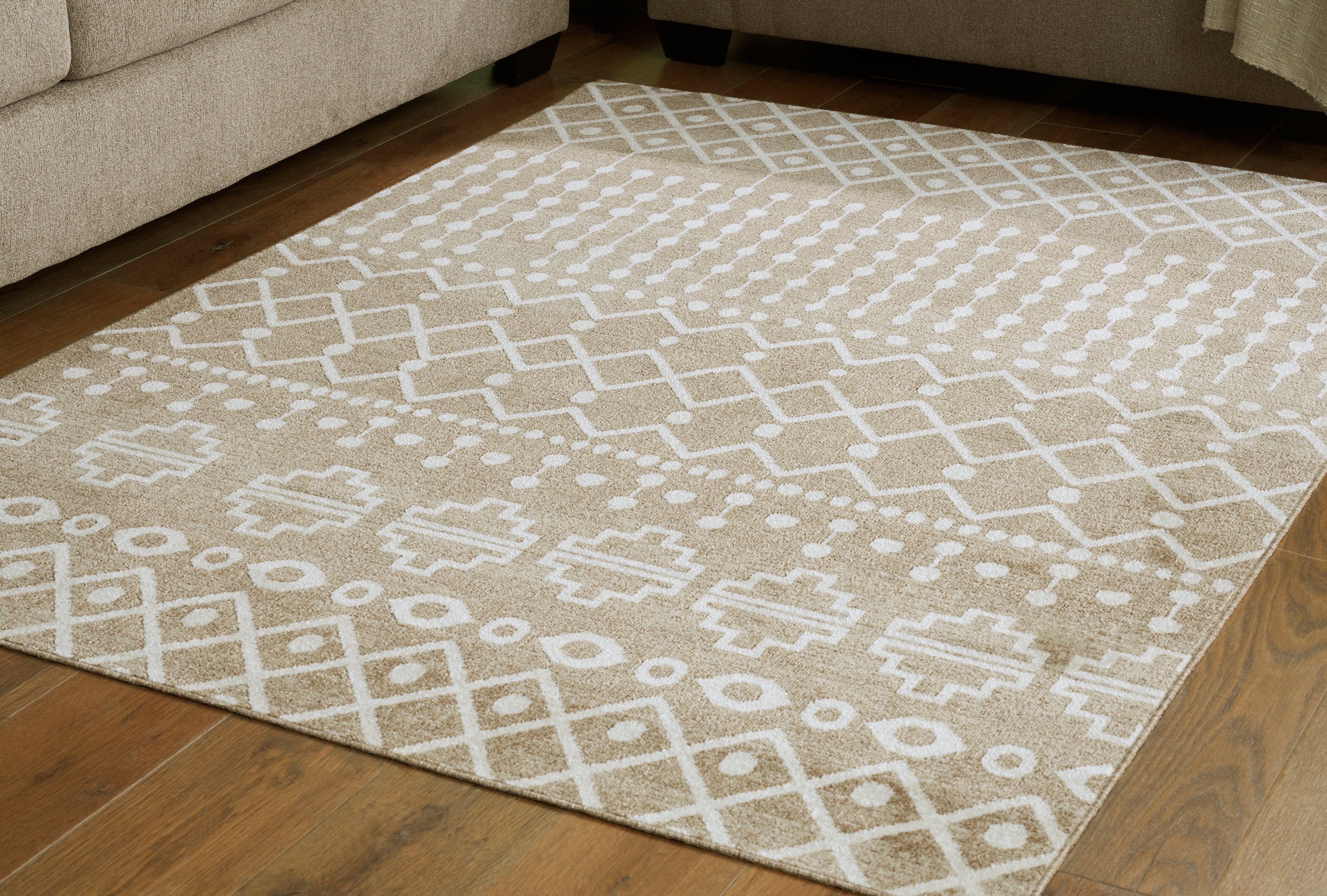 3 Brothers Decor - Ashley Furniture - Bunchly Rug - 4'11" x 7'2" Washable Rug / Tan/Brown/Cream - R406222