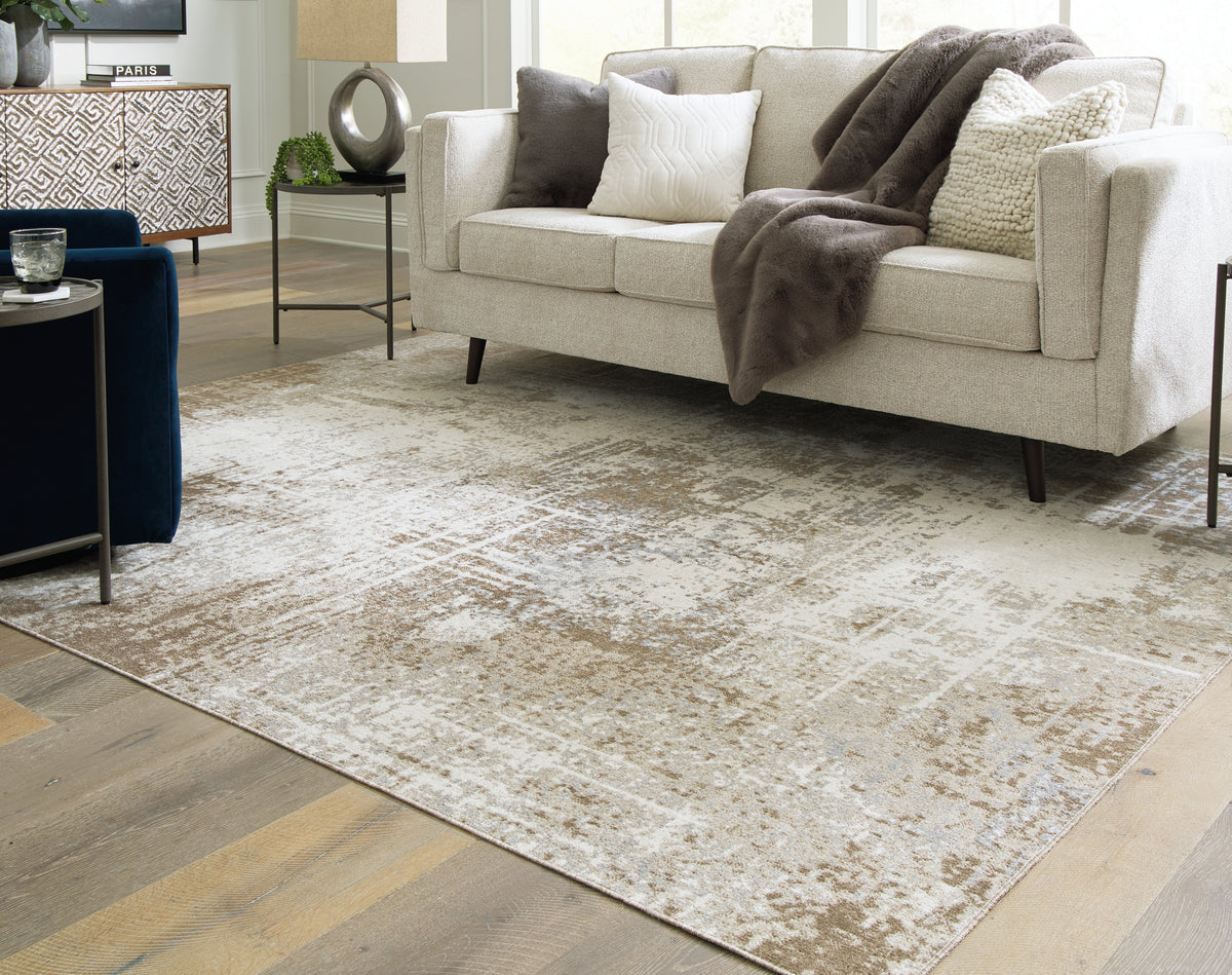 3 Brothers Decor - Ashley Furniture - Grifflain Rug - 7'10" x 10'3" Washable Rug / Tan/Brown/Gray - R406231