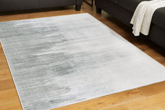3 Brothers Decor - Ashley Furniture - Milset Rug - 8'1" x 10' Washable Rug / Black/White/Gray - R406251