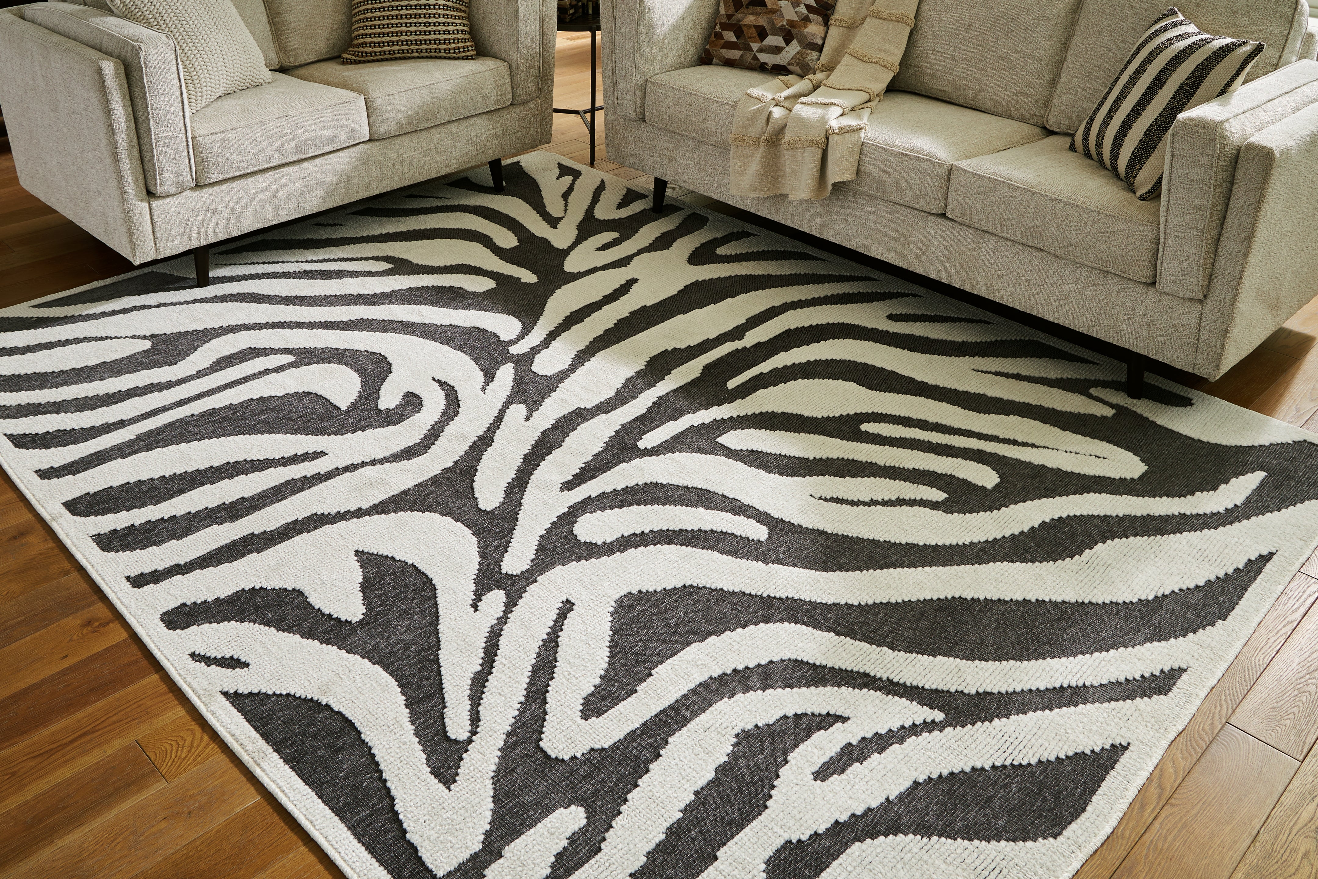 3 Brothers Decor - Ashley Furniture - Thomwith Rug - 8' x 10'2" Washable Rug / Black/Ivory - R406291