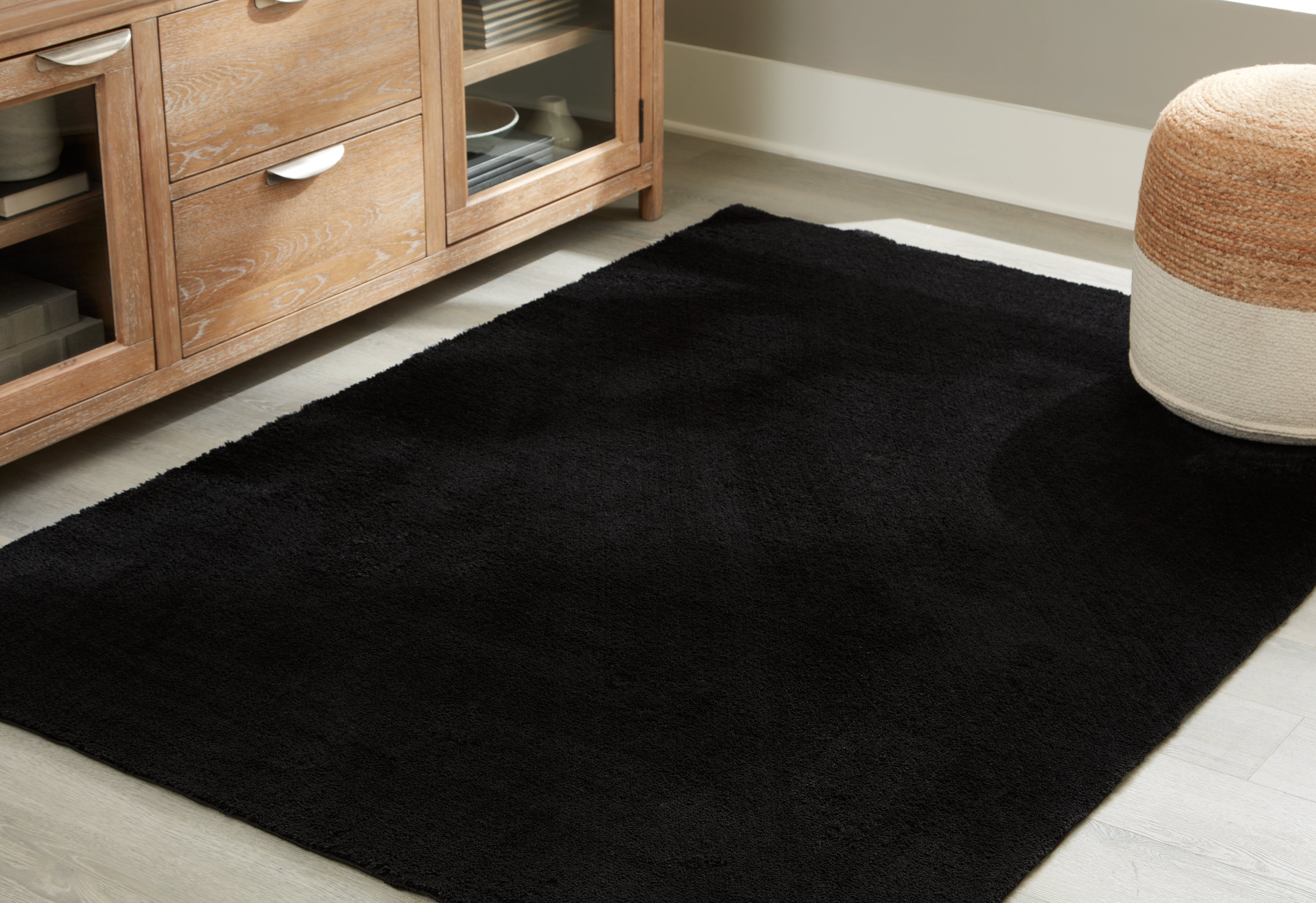 3 Brothers Decor - Ashley Furniture - Anaben Rug - 5' x 7' Washable Rug / Black - R406312