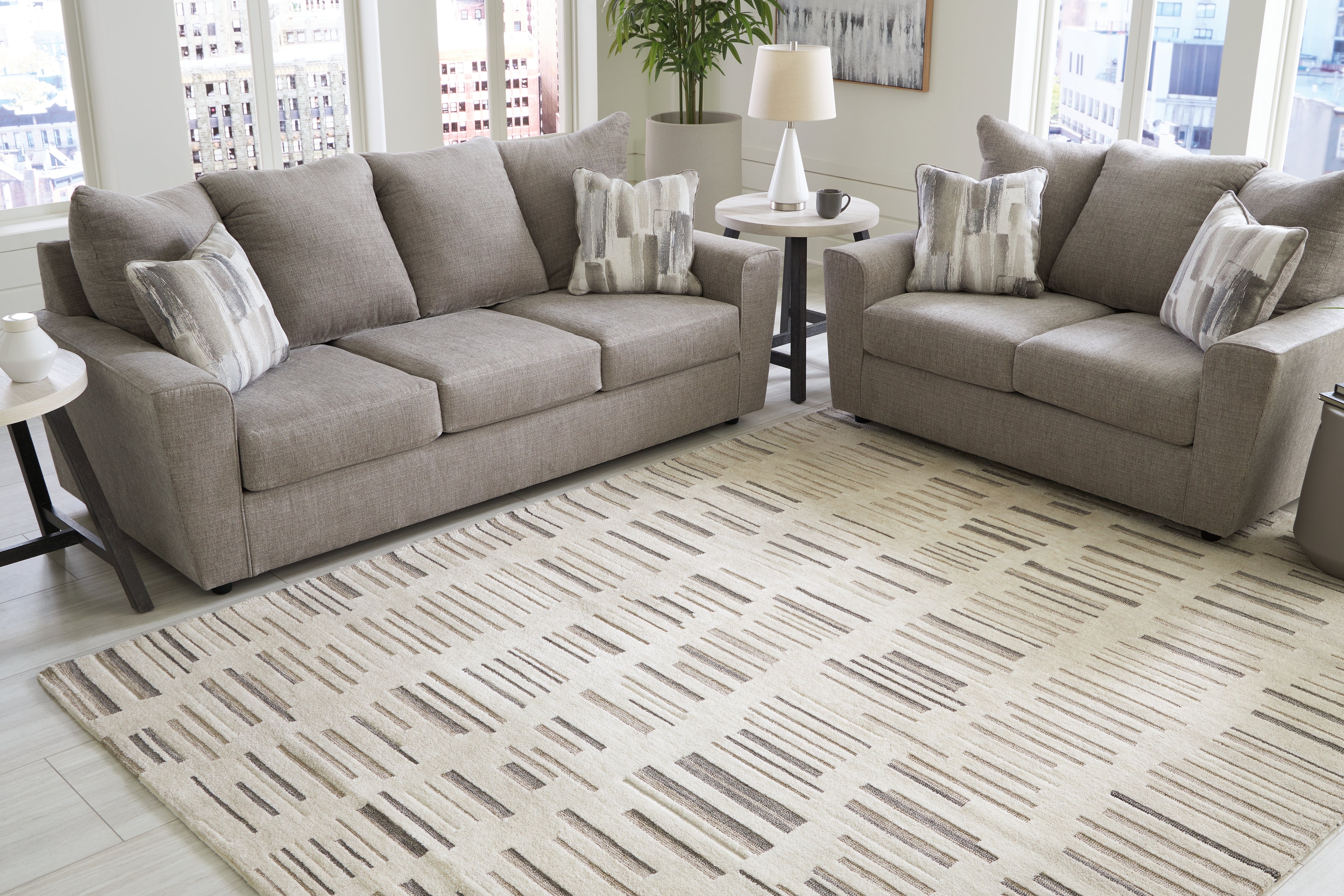 3 Brothers Decor - Ashley Furniture - Leesdale Rug - 8' x 10' Rug / Ivory/Brown/Black - R406421