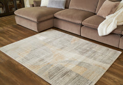 3 Brothers Decor - Ashley Furniture - Truward Rug - 5' x 7' Rug / Linen/Gray/Caramel - R406472
