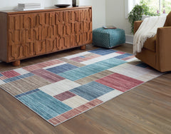 3 Brothers Decor - Ashley Furniture - Numore Rug - 5'2" x 6'11" Washable Rug / Multi - R406662