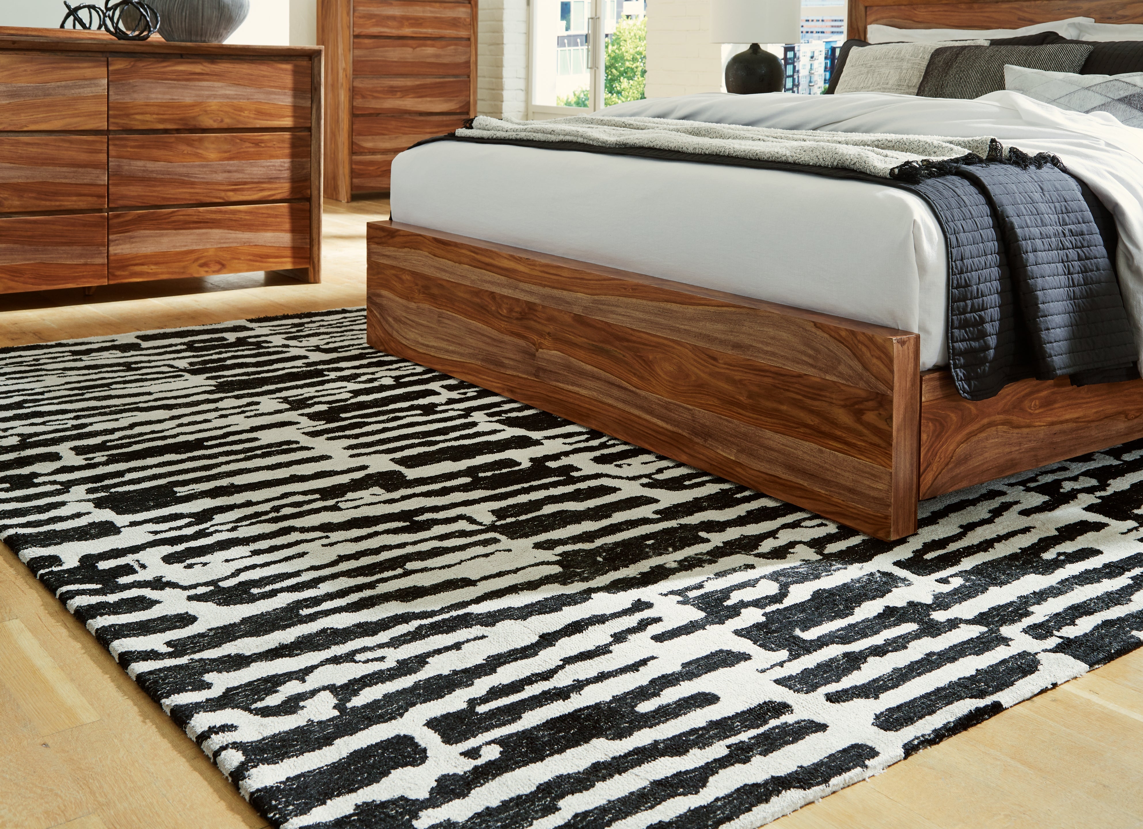 3 Brothers Decor - Ashley Furniture - Bramshaw Rug - 8' x 10' Rug / Black/Ivory - R406761