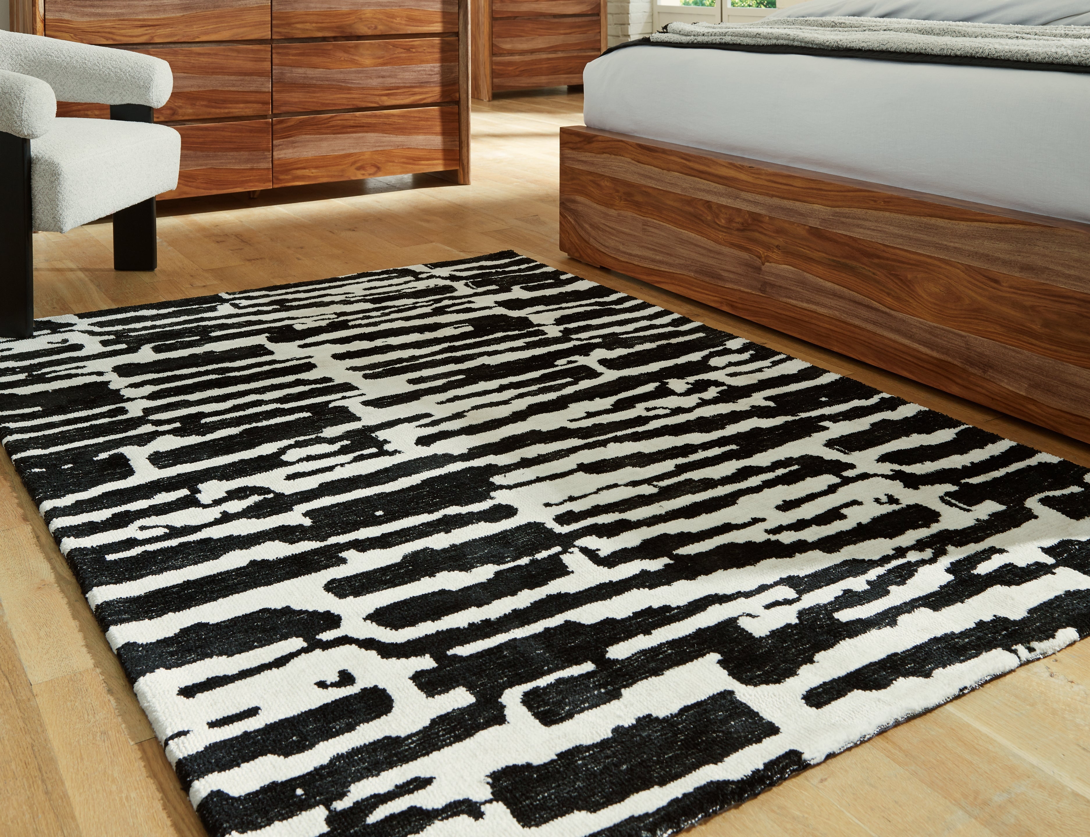 3 Brothers Decor - Ashley Furniture - Bramshaw Rug - 5' x 7' Rug / Black/Ivory - R406762