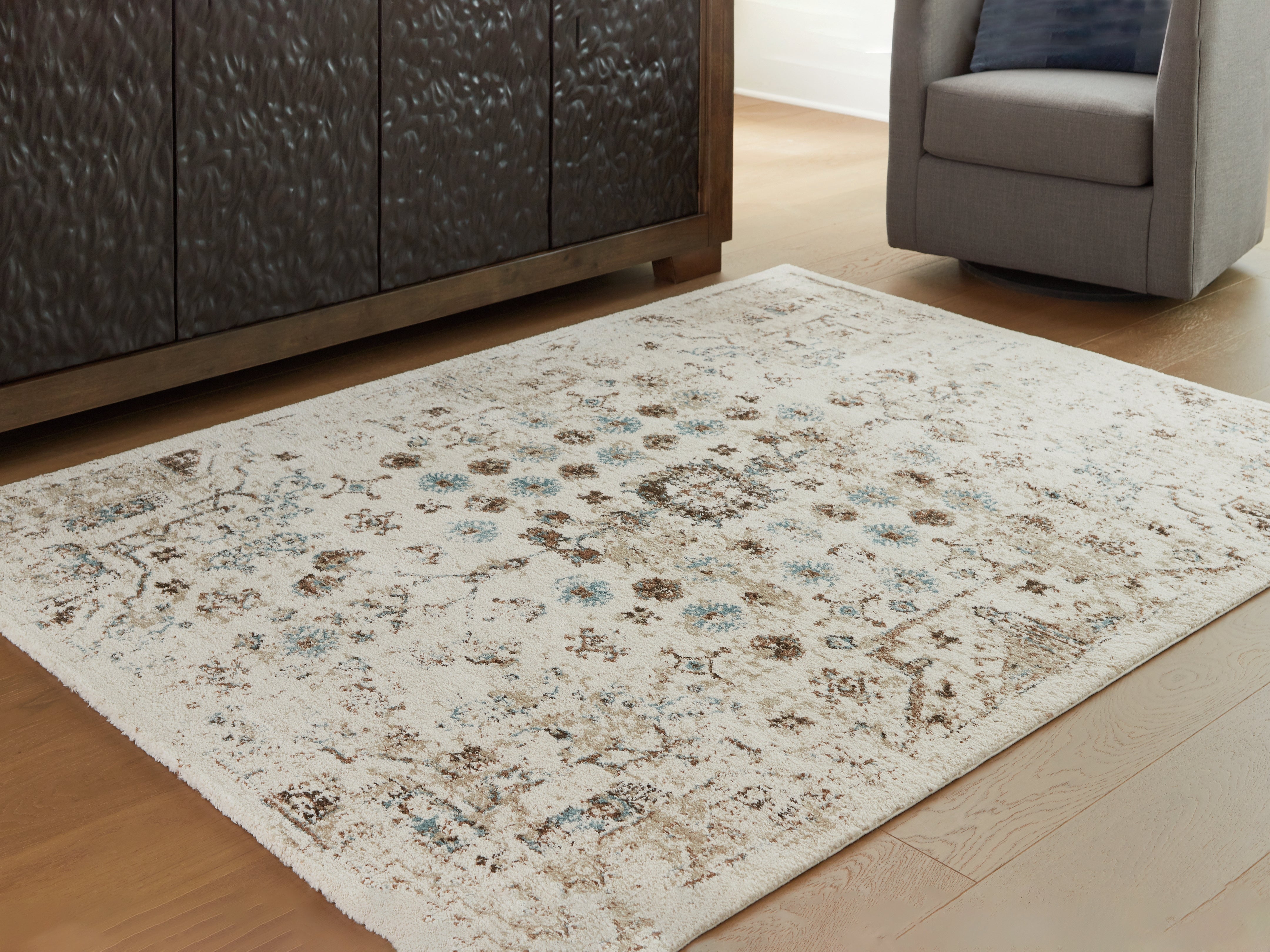 3 Brothers Decor - Ashley Furniture - Jossler Rug - 8' x 10' Rug / Ivory/Brown/Teal - R407071