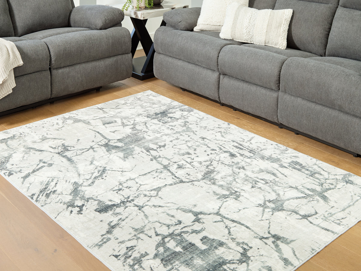 3 Brothers Decor - Ashley Furniture - Tobinbury Rug - Washable 5' x 7' Area Rug / Gray - R407422
