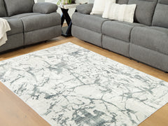 3 Brothers Decor - Ashley Furniture - Tobinbury Rug - Washable 5' x 7' Area Rug / Gray - R407422
