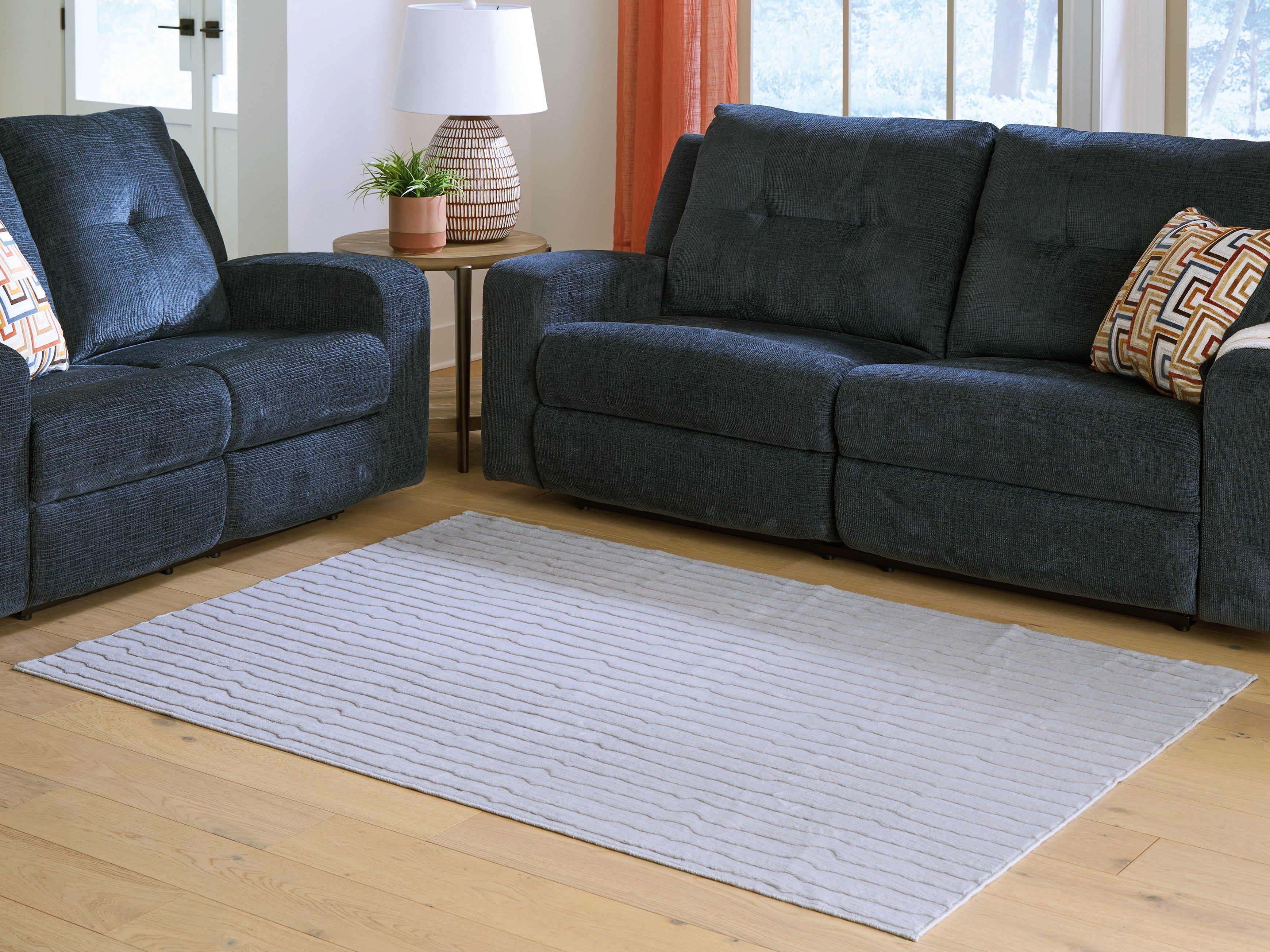 3 Brothers Decor - Ashley Furniture - Worthley Rug - Washable 5' x 7' Area Rug / Gray - R407452