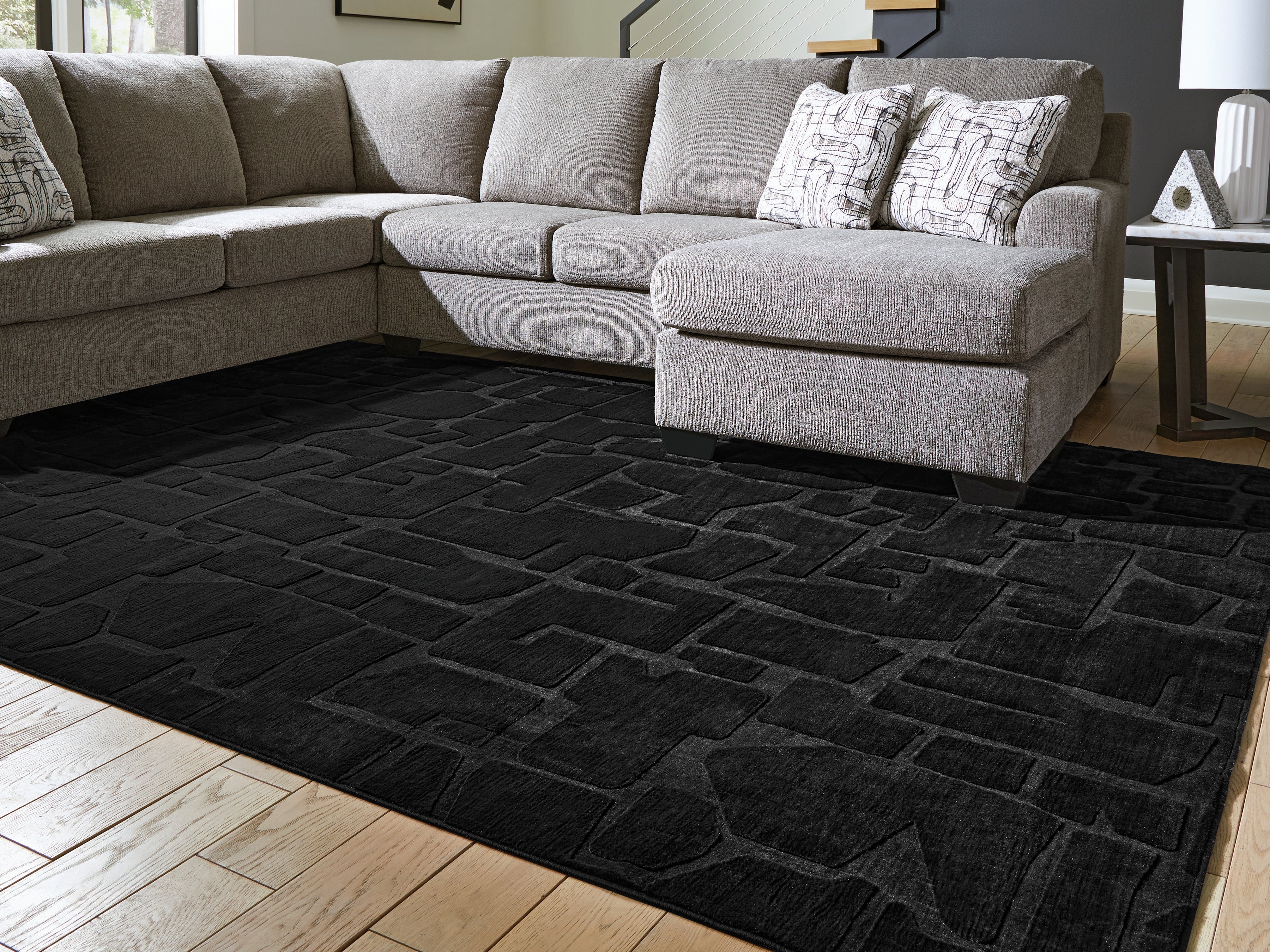 3 Brothers Decor - Ashley Furniture - Gibbswell Rug - Washable 8' x 10' Area Rug / Black - R407461