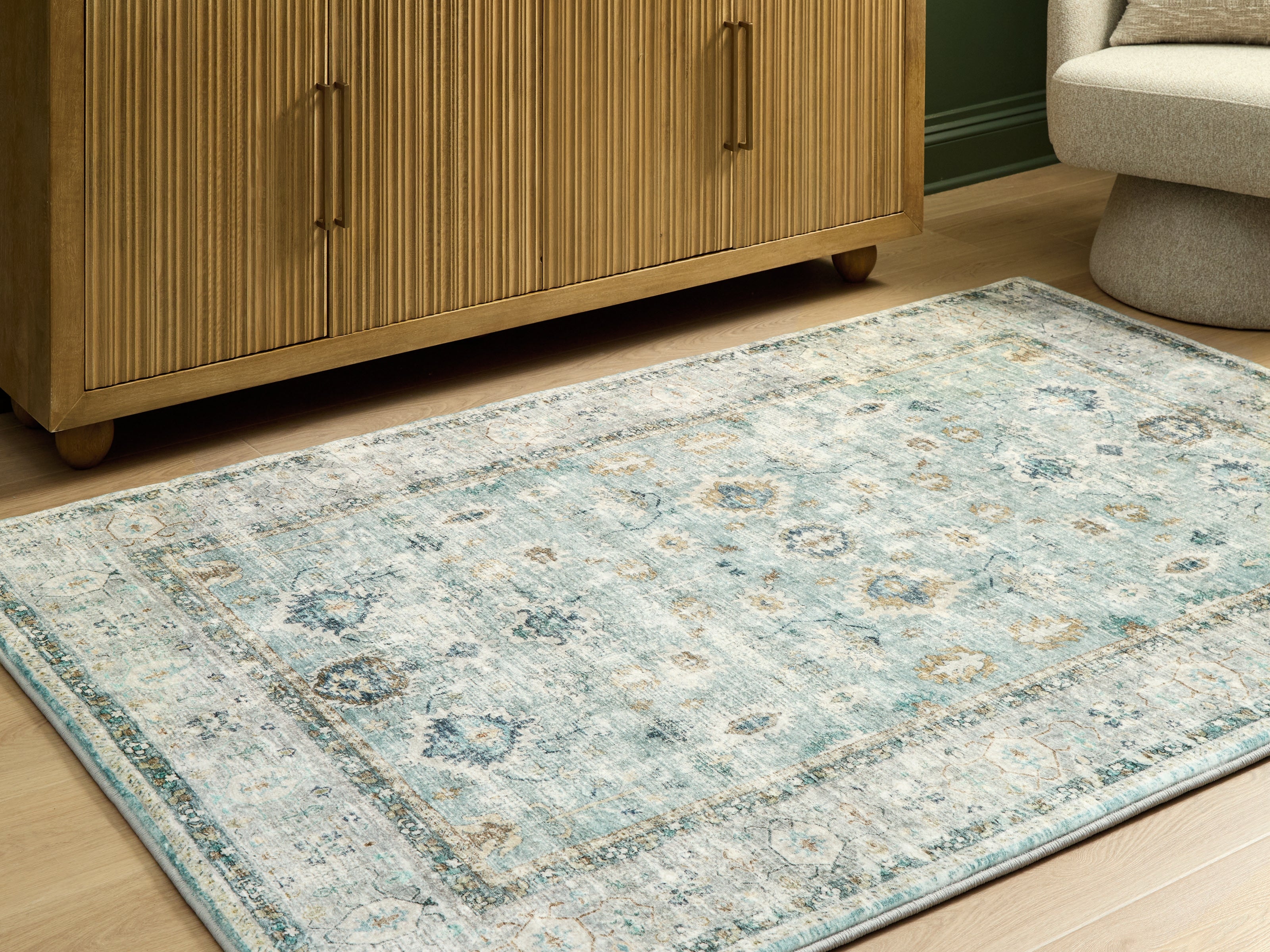 3 Brothers Decor - Ashley Furniture - Ladstoney Rug - 5' x 7' Area Rug / Teal/Beige/Ochre - R407502