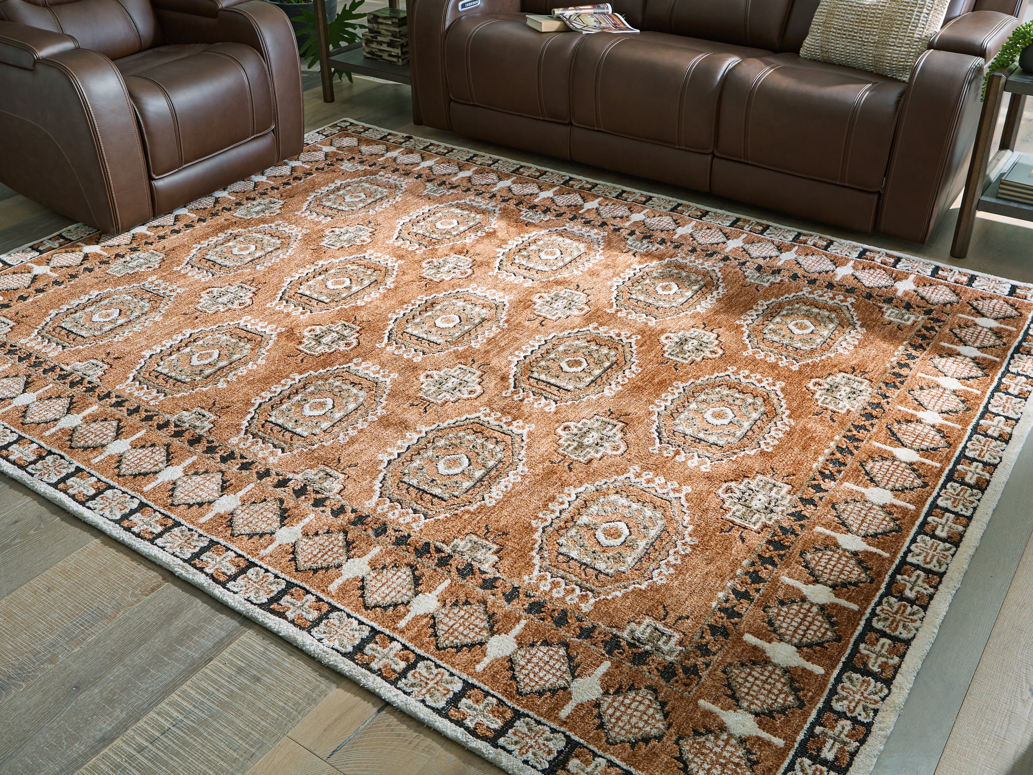 3 Brothers Decor - Ashley Furniture - Qaabiz Rug - 7'8" x 10' Area Rug / Sienna/Ivory/Black - R407521