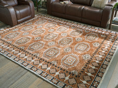 3 Brothers Decor - Ashley Furniture - Qaabiz Rug - 7'8" x 10' Area Rug / Sienna/Ivory/Black - R407521