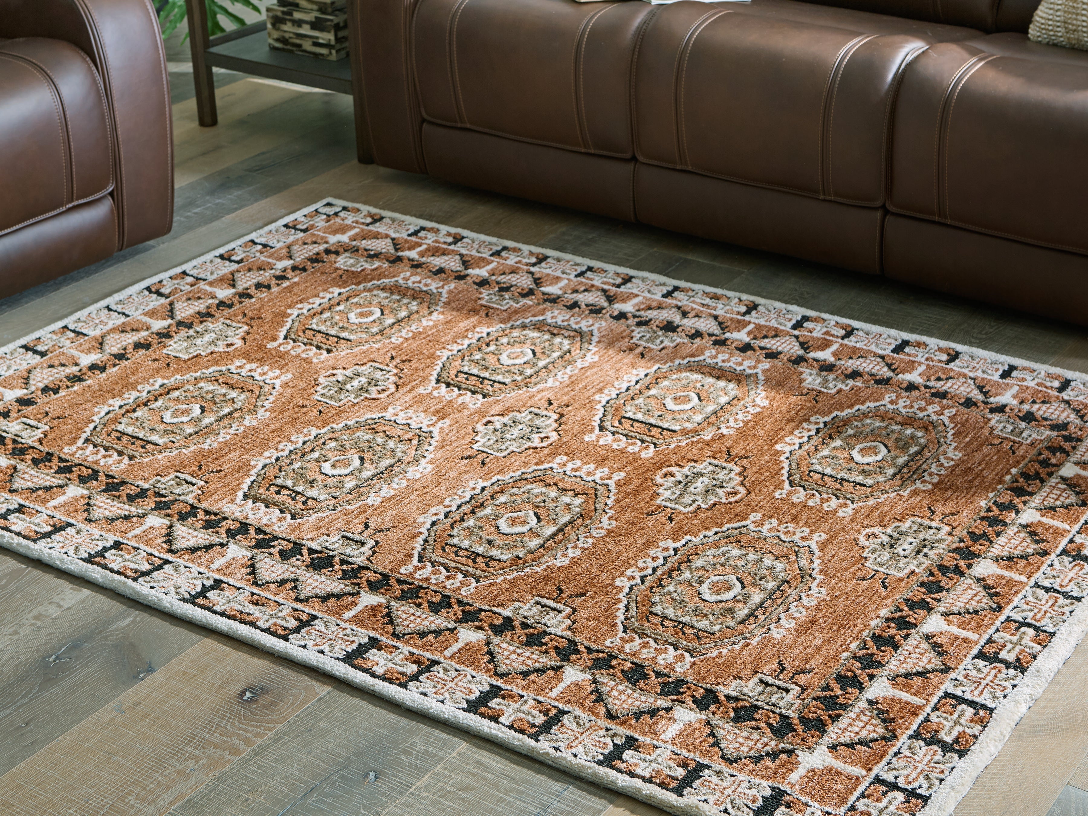 3 Brothers Decor - Ashley Furniture - Qaabiz Rug - 5' x 7' Area Rug / Sienna/Ivory/Black - R407522