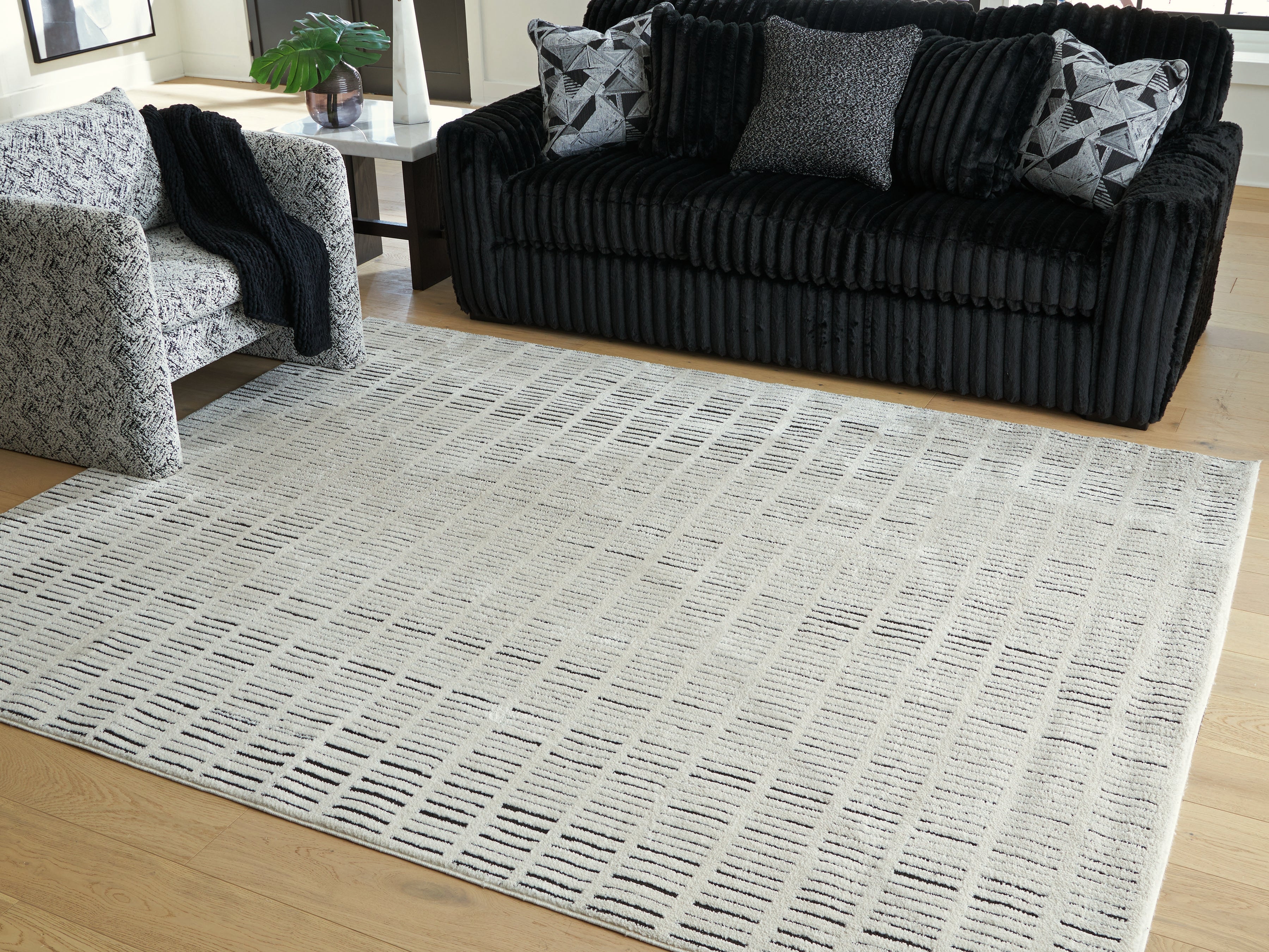 3 Brothers Decor - Ashley Furniture - Turinwith Rug - 7'10" x 9'10" Area Rug / Ivory/Black - R407551