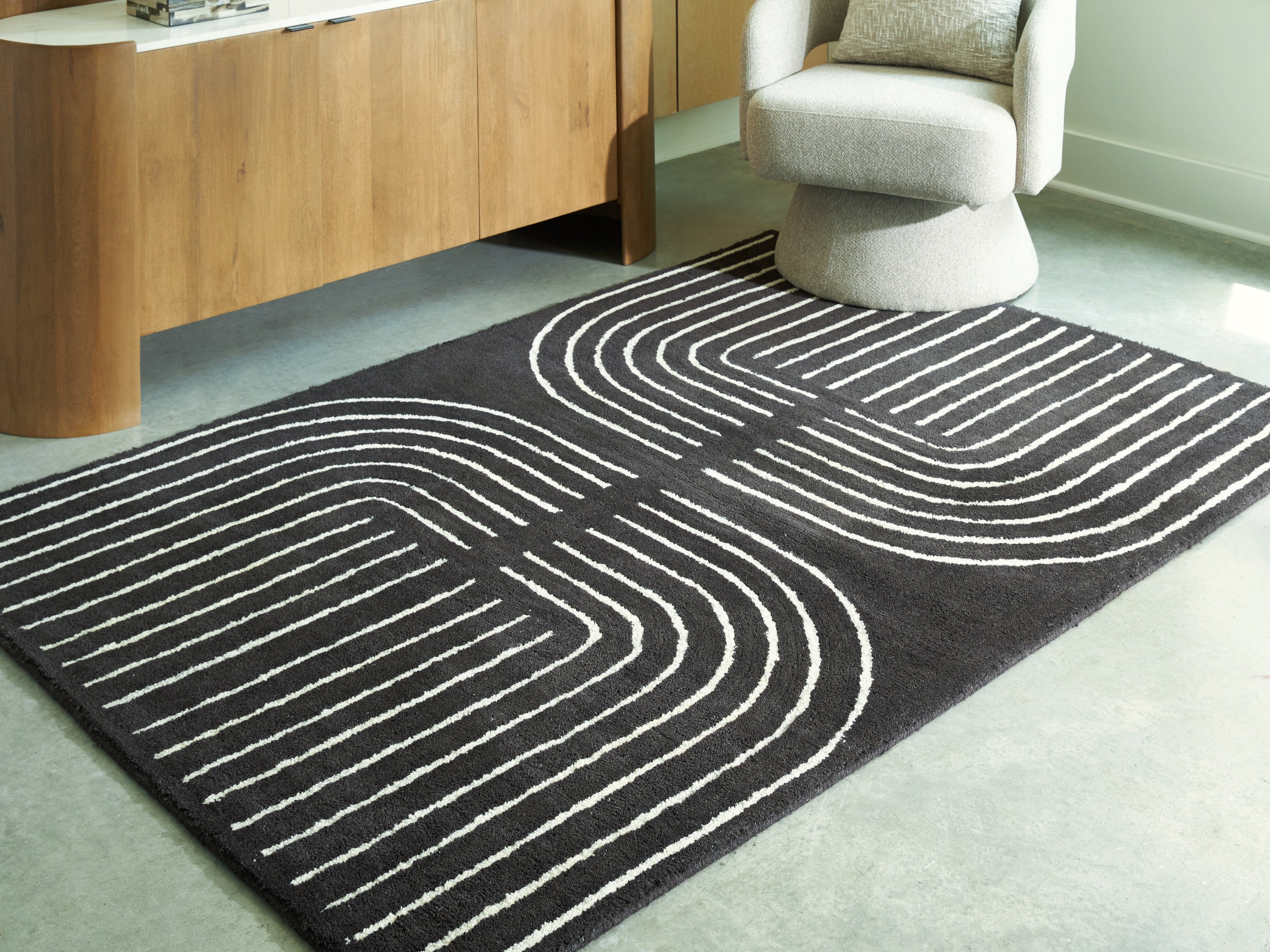 3 Brothers Decor - Ashley Furniture - Eldonmore Rug - 5' x 7' Area Rug / Black/Ivory - R407572