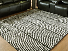 3 Brothers Decor - Ashley Furniture - Kurtmen Rug - 7'10" x 9'10" Area Rug / Black/Ivory - R407591