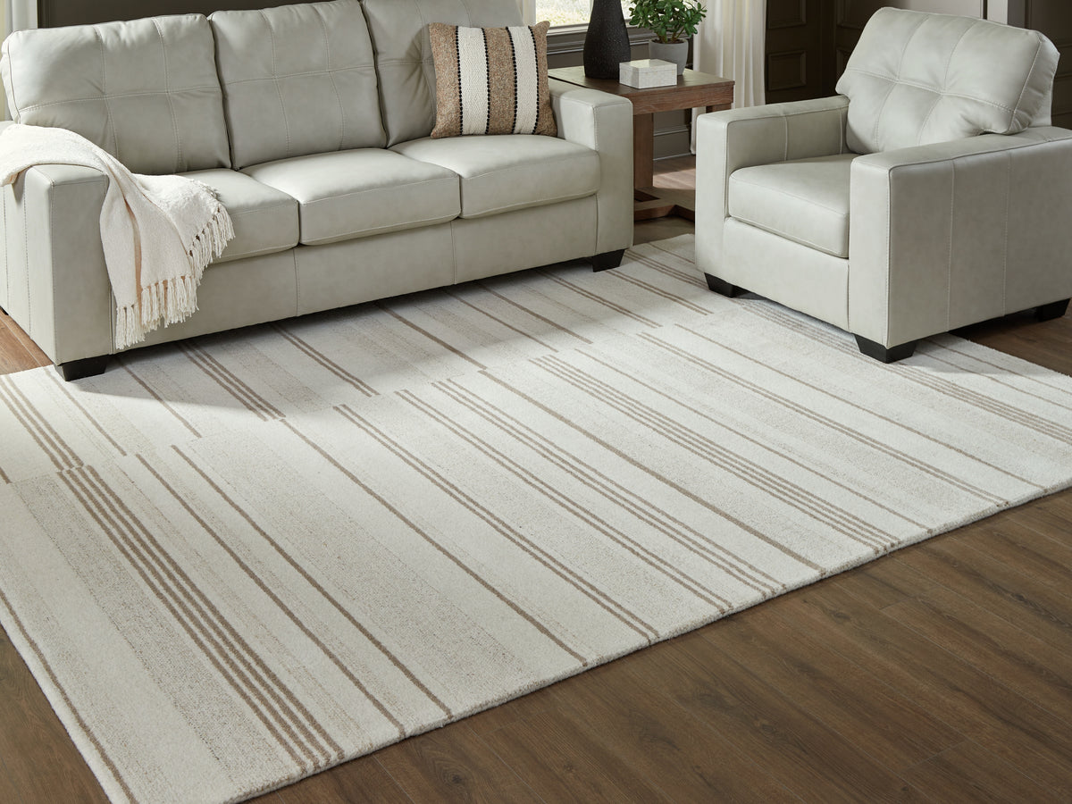 3 Brothers Decor - Ashley Furniture - Gadence Rug - 7'8" x 10' Area Rug / Ivory/Tan - R407641