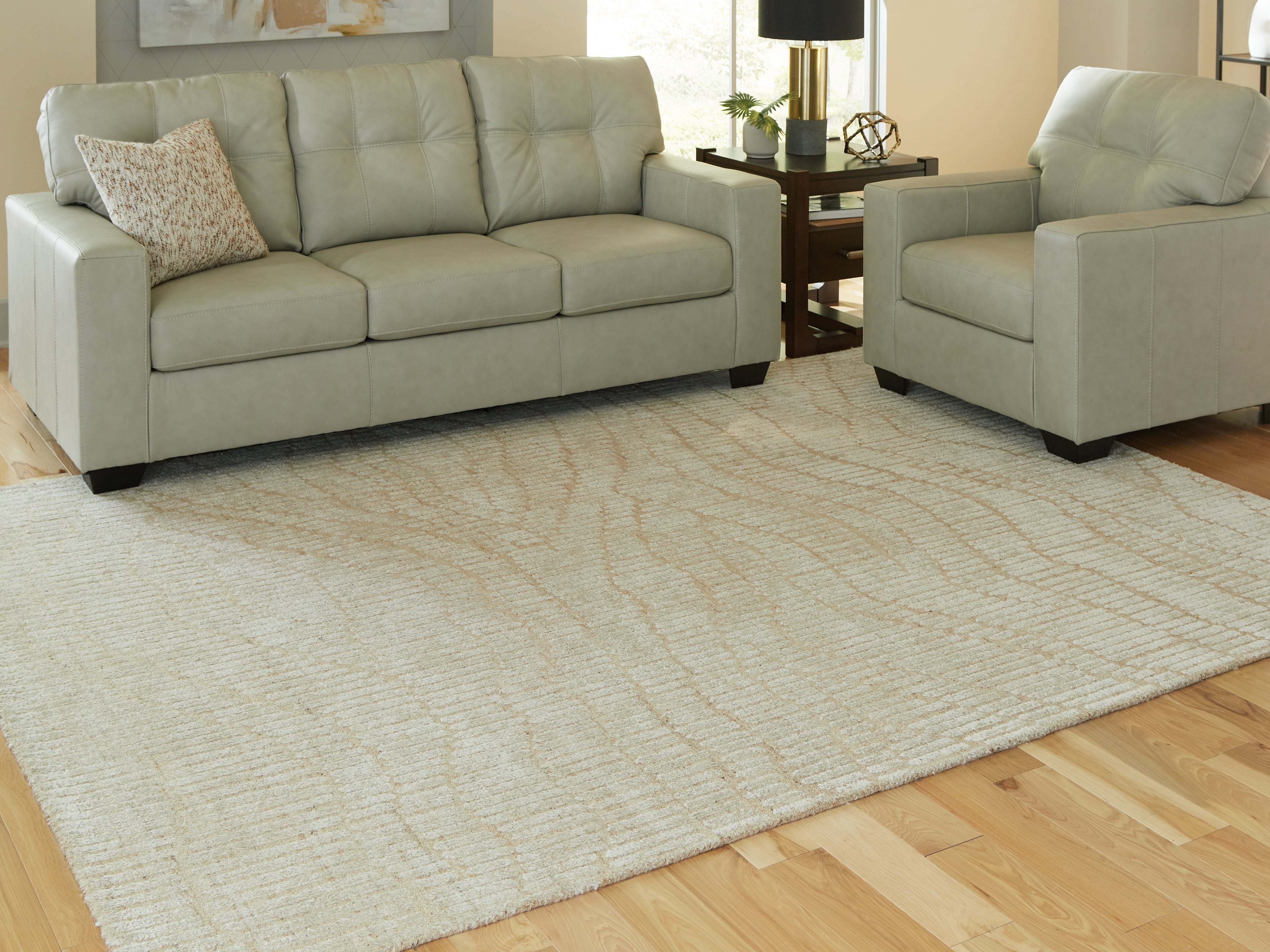 3 Brothers Decor - Ashley Furniture - Jaseena Rug - 7'8" x 10' Area Rug / Beige/Tan - R407721