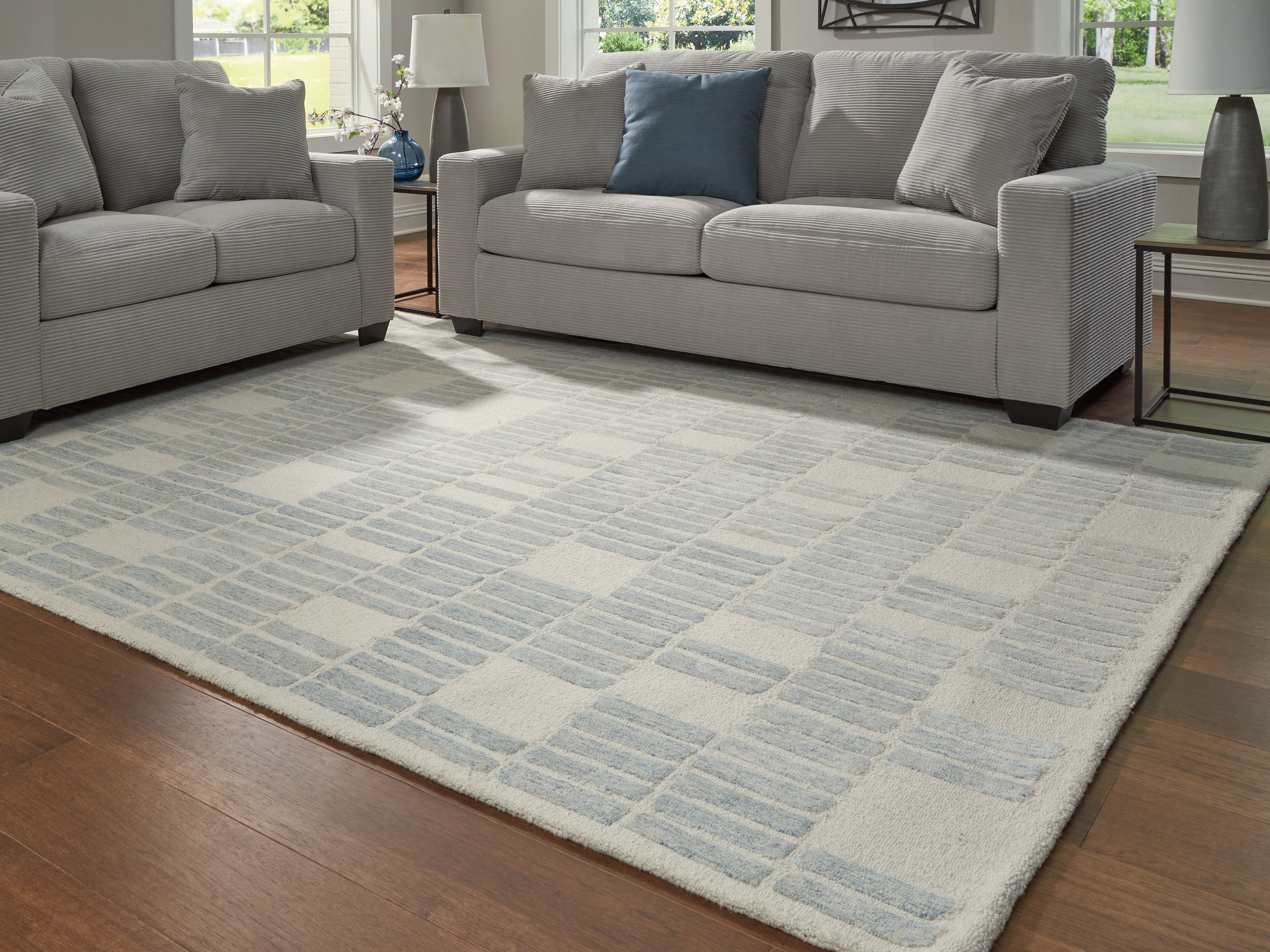 3 Brothers Decor - Ashley Furniture - Dylanton Rug - 7'8" x 10' Area Rug / Ivory/Blue - R407811