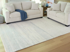 3 Brothers Decor - Ashley Furniture - Genemost Rug - 7'8" x 10' Area Rug / Ivory/Blue - R407841