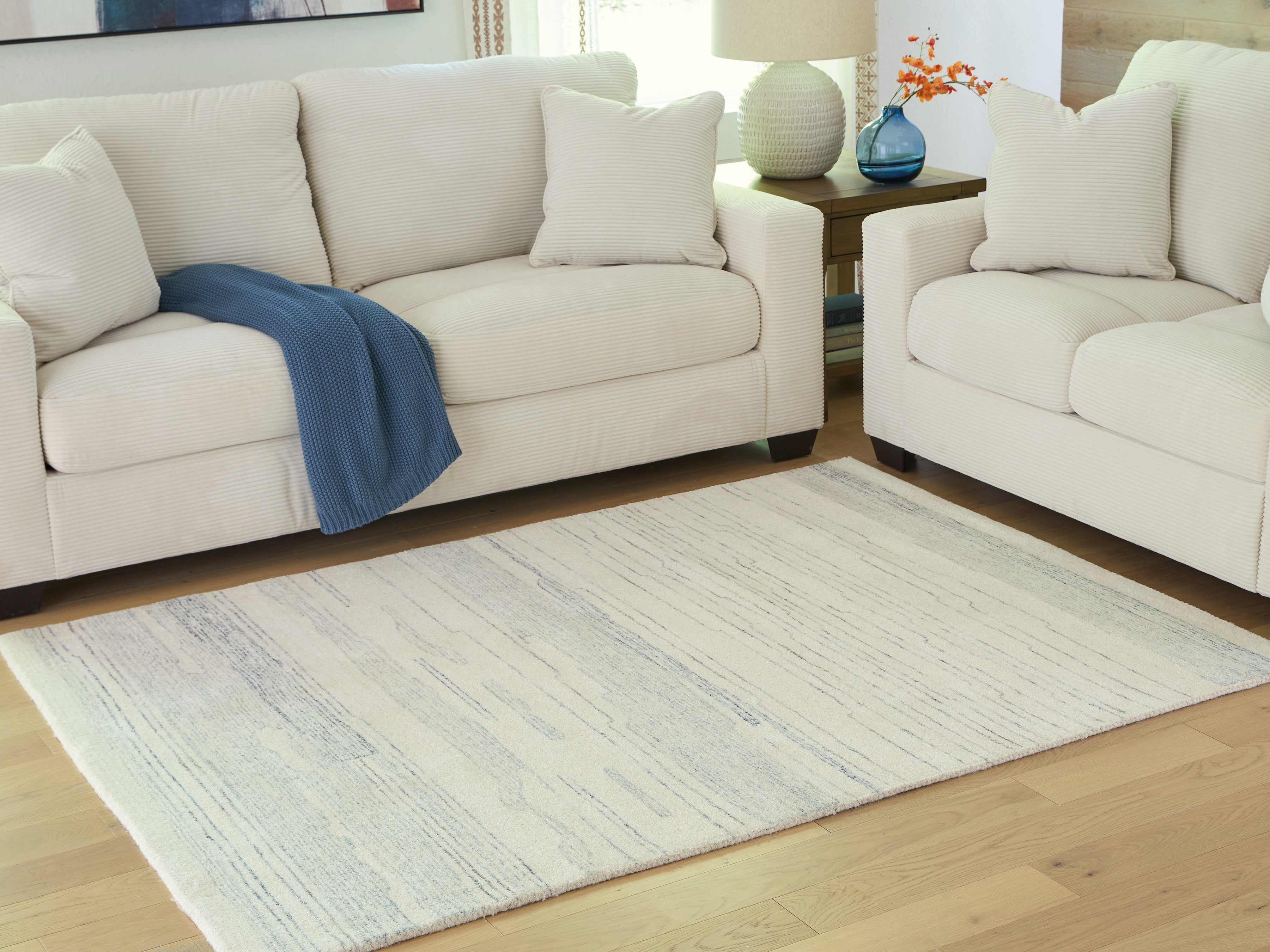 3 Brothers Decor - Ashley Furniture - Genemost Rug - 5' x 7' Area Rug / Ivory/Blue - R407842