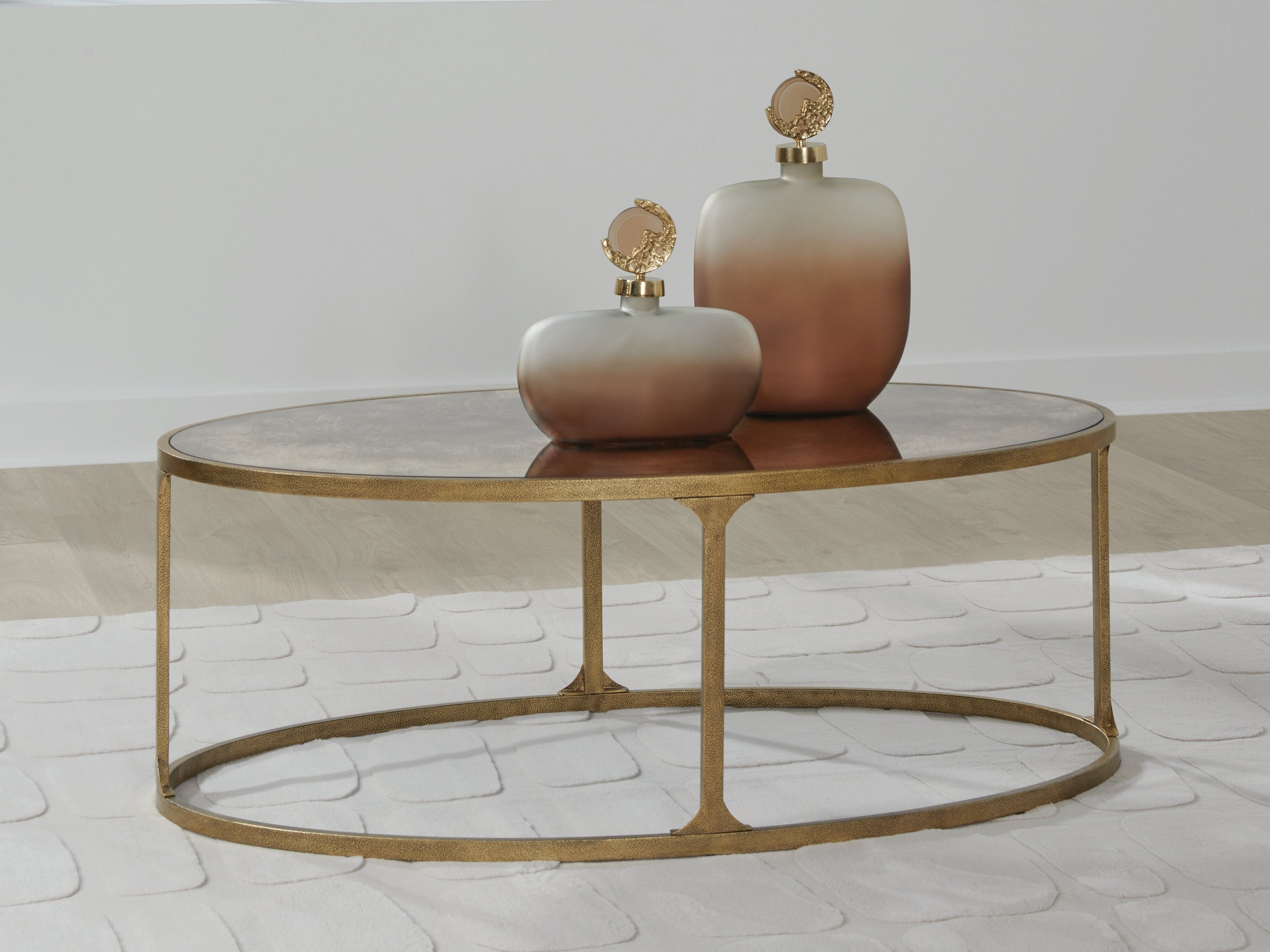 3 Brothers Decor - Ashley Furniture - Korajane Coffee Table - Oval Cocktail Table / Antique Gold - T399-0