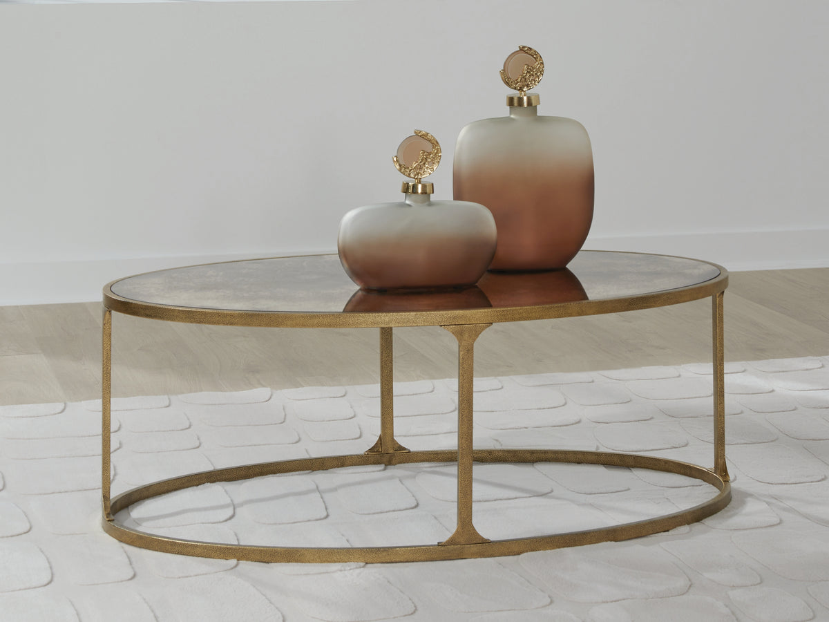 3 Brothers Decor - Ashley Furniture - Korajane Coffee Table - Oval Cocktail Table / Antique Gold - T399-0