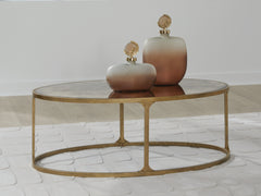 3 Brothers Decor - Ashley Furniture - Korajane Coffee Table - Oval Cocktail Table / Antique Gold - T399-0