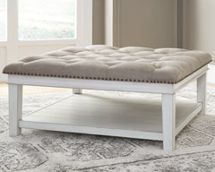 3 Brothers Decor - Ashley Furniture - Kanwyn Upholstered Ottoman Coffee Table - UPH Ottoman Cocktail Table / Whitewash - T937-21