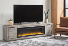 3 Brothers Decor - Ashley Furniture - Naydell 92" TV Stand with Electric Fireplace - 92" TV Stand with Electric Fireplace / Gray - W996W1