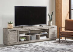 3 Brothers Decor - Ashley Furniture - Naydell 92" TV Stand - 92" / Gray - W996-78
